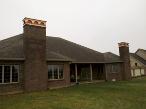 two installed custom chimney shrouds